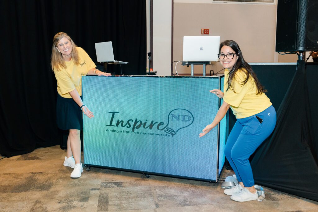 Inspire ND team members smiling together at a community event